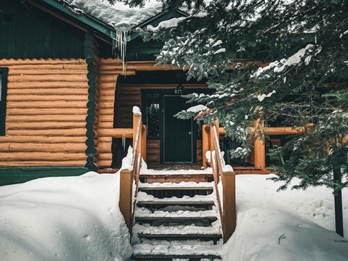 cabin in snowy woods
